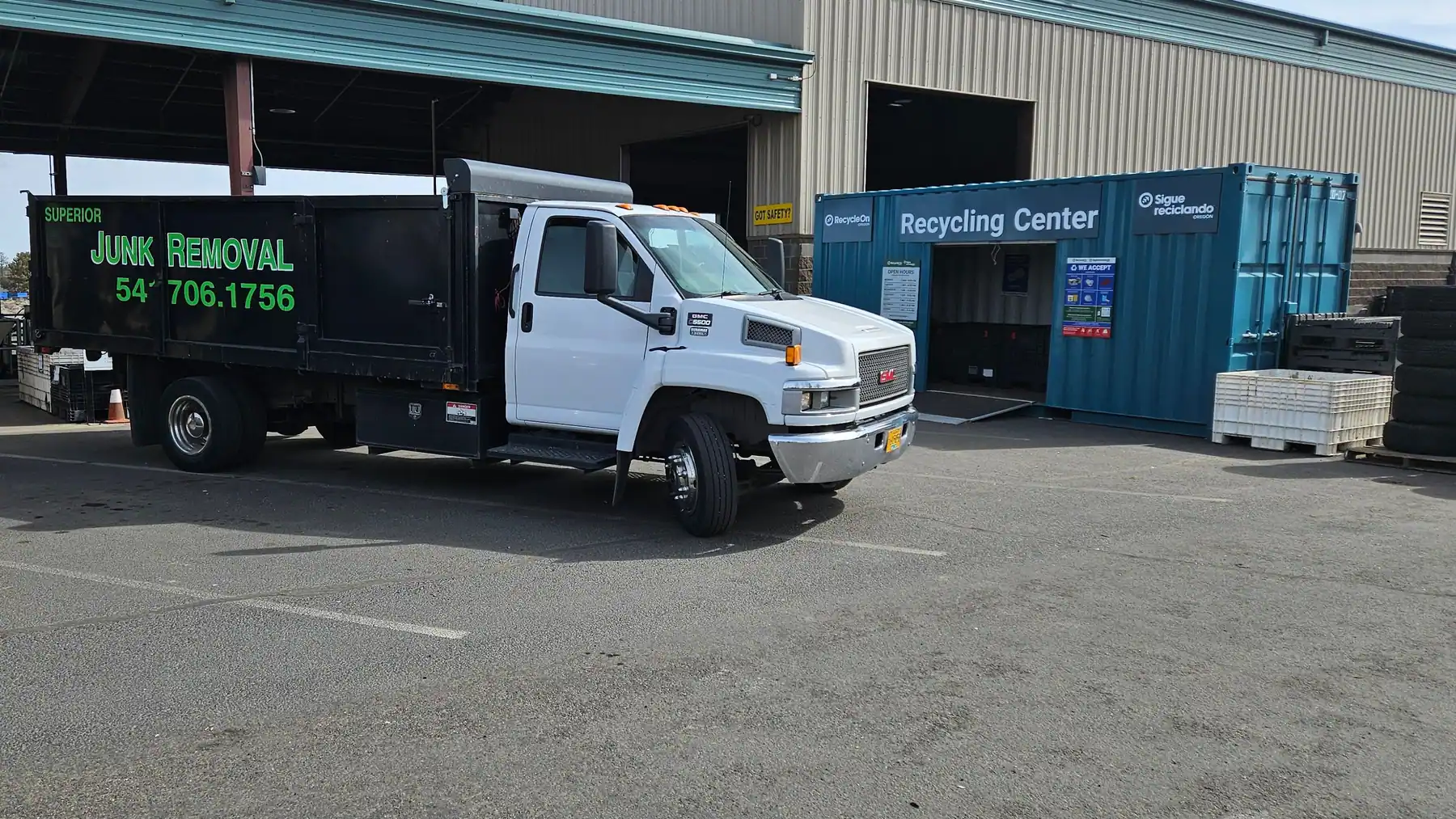 The Superior Junk Removal dump truck parked at the recycling center