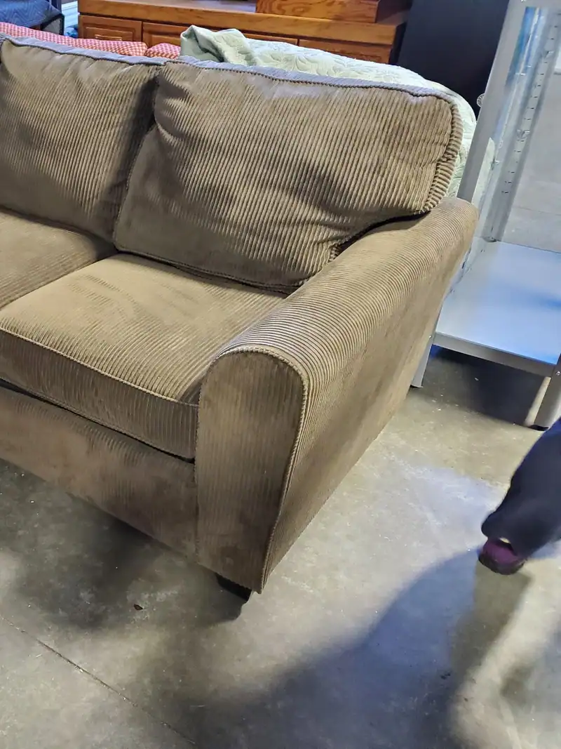 An old green fabric couch